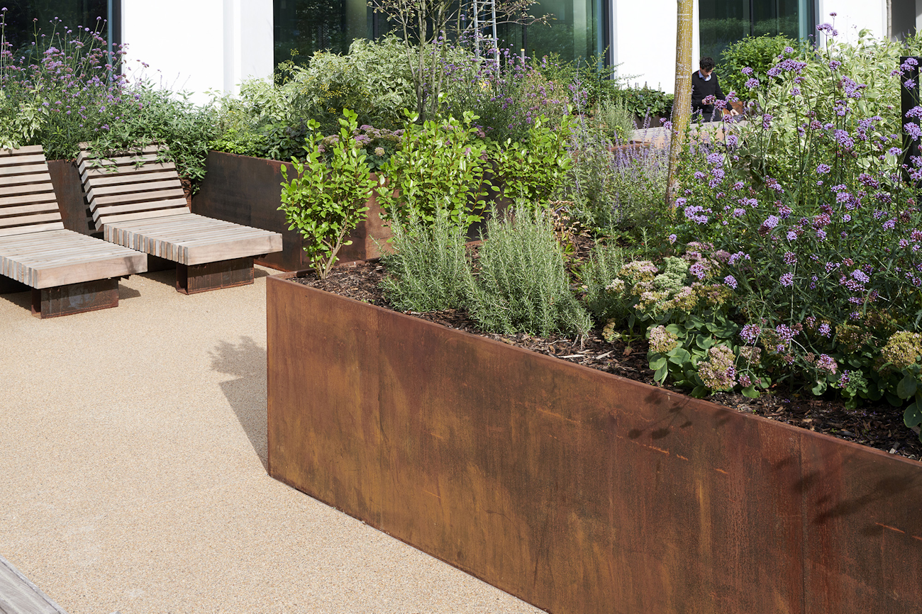 Corten steel planters and timber benches at 245 Hammersmith