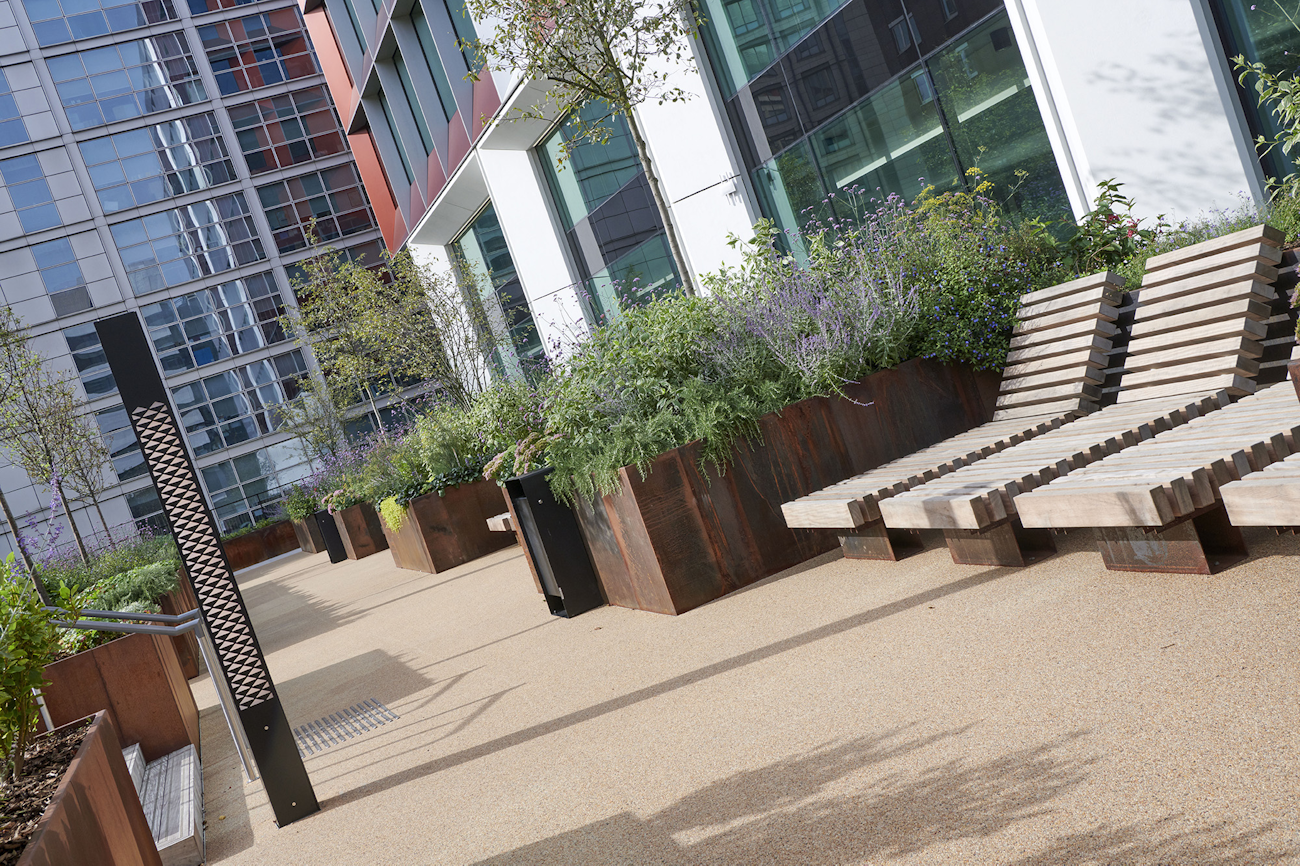 Corten steel planters and timber benches at 245 Hammersmith